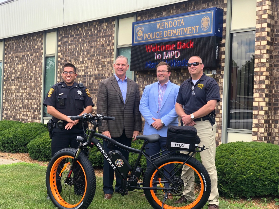 Omega auto care donates e-bike to mendota police